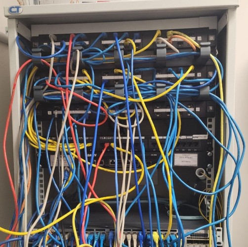 Network rack re-wiring and testing for a small business